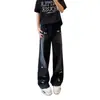 Pantalones vaqueros negros con dobladillo curvo y bordado de dibujos animados para hombre y mujer, estilo americano, desgastados, de talle alto, lavados, de pierna recta y ligeramente acampanados.