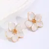 Europa y Estados Unidos pendientes transfronterizos color dulce ins flor de gota de aceite moda simples pendientes de flor de cinco pétalos tridimensionales pendientes