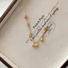 Collar con colgante de bolsa de filigrana fructífera chapado en oro de 18 quilates antiguo, borla, florecilla, cadena para la clavícula de lujo ligero de alta gama