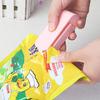 Máquina portátil creativa de sellado a presión manual, mini máquina de sellado de bolsas de alimentos, máquina de sellado de bolsas de plástico con calefacción.