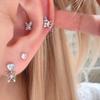 Aretes pequeños de mariposa con bloques de color, calados, diseño de nicho dulce y cool, para el cuidado de las orejas
