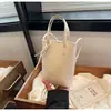 Bolsa de Ombro Transversal Grande Versátil Nova Tendência da Moda Primavera 2026 com Acabamento de Luxo e uma Bolsinha de Celular Estilo Bolsa de Mão