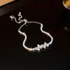 Pulseira super brilhante colorida de zircônia adorável em forma de cobra e borboleta, pulseira de temperamento de luxo leve, pulseira de nicho de personalidade de alta qualidade para mulheres