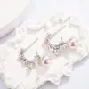 Brincos de Laço Francês com Pérola Rosa de Imitação para Mulheres 2026 Novo Popular Design de Nicho Brincos Modernos e Elegantes