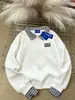 Sudadera de Marca Nicho de Moda Chic Falsa de Dos Piezas para Mujer Otoño e Invierno 2025 Holgada Casual Retro Cuello Polo Empalme Top