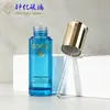 Botella de vidrio transparente redonda de 30 ml con gotero recto escalonado, con bomba de gotero en forma de diamante dorada galvanizada para envasado de sérum, aceite esencial y producto para el cuidado de la piel