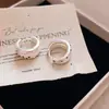 Pendientes asimétricos de lunares con goteo de aceite, estilo vintage francés de doble capa, lujo ligero con un toque de alta gama, pendientes de diseño nicho para mujer