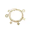 Pulseira de Franja Personalizada Dourada Oca Trevo de Quatro Folhas Transfronteiriça para Mulheres, Pulseira de Flor Prismática da Moda Japonesa e Coreana que Não Desbota