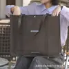 Bolsa de tela no tejida ecológica engrosada con logotipo personalizado, adecuada para tiendas de ropa y uso general en centros comerciales
