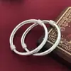 Plata de ley S999 bebé bebé pulsera de plata de ley cerradura de larga vida femenina redonda brillante panza enrollada Pulsera para niños bebés Hombres y mujeres