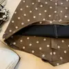 Tiro real: Elegante saia de camurça com poá para mulheres, nova saia curta slim fit de outono que abraça o quadril, saia curta evasê que rejuvenesce para mulheres
