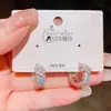 Pendientes de aro de trébol de cuatro hojas con circonita estilo vintage, pendientes dulces de lujo ligero de alta gama populares para mujer