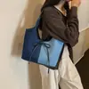 Bolso tote de gran capacidad para mujer, nuevo modelo de verano 2026, bolso simple casual para el hombro, bolso versátil de moda para mujer