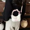 Bolso de mano de gato dulce y lindo estilo coreano, un bolso cruzado mini y único para madres e hijas, con un diseño plisado y una sensación moderna, ligera y lujosa.