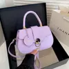 Bolso de mano retro de alta gama con tapa abatible para mujer 2026 nuevo bolso cuadrado pequeño con cierre simple para el trabajo de un solo hombro cruzado bolso de mujer