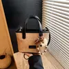 Bolso Tejido de Playa de Verano Transfronterizo para Mujer 2026 Nuevo Estilo de Verano Bolso Cubo Pequeño Súper Popular Bolso Cruzado
