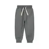 Calça infantil minizone 2026 Outono Inverno Nova Calça para Meninos Calça Esportiva Versátil Saída Calça Casual para Meninas