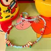 ¡¡¡Súper lindo!!! Collar Colgante Perro Globo M&M Rojo para Mujer, Nuevo Accesorio de Cadena para Suéter de Alta Gama Otoño e Invierno 2025