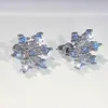 Traje de joyería clásica para boda anillo de copo de nieve pendientes de botón de circón azul para mujer traje de anillo de collar joyería transfronteriza europea y americana
