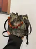 Nuevo bolso de estilo chino, nuevo bolso de cubo bordado de estilo nacional de alta gama, bolso de mano con cuentas, bolso cruzado de hombro para mujer