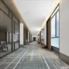 Las alfombras Akmnesty se personalizan para habitaciones de hotel de estrellas y salones de banquetes, presentando alfombras de lana y nailon ignífugas y resistentes a las manchas de cobertura total