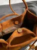 Bolso de axila vintage de gamuza para otoño e invierno para mujer, gran capacidad, nuevo modelo 2026, bolso tote de moda de alta gama para el día a día