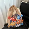 Bolso nuevo, moderno y de moda para mujer, con un estilo relajado y casual, perfecto para ir al trabajo, con un diseño tejido y un patrón de peces, lo que lo convierte en un bolso tote elegante.