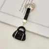 Llavero de bolso con incrustaciones de diamantes de arcilla transfronterizo, lleno de diamantes, accesorio de llavero de coche deslumbrante de alta gama
