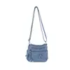 Bolso de mujer transfronterizo nuevo moda retro bolso de mezclilla mochila pequeña de viaje moda multibolsillo bandolera bolso pequeño