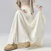 Foto Real da Nova Saia Plissada de Design para Primavera/Verão 2026 com Cintura Elástica, Efeito Emagrecedor, Caimento Elegante e Estilo Plissado Evasê