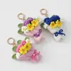 Día de Año Nuevo 2026 Flor de Hilo Nueva Hecha a Mano Linda Crochet de Cuatro Hilos Flor de Springfield Llavero Regalo para Personas Mayores