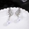 Pendientes de perlas de alta gama, sencillos, ligeros y de lujo, de estilo coreano con aguja plateada y diseño de nicho, con alas asimétricas y diamantes.