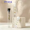 Botella dispensadora de tubo de ensayo mini de 2 ml con aplicador para prueba de fragancias, botella de muestra cosmética, tapón a juego, botella de vidrio vacía para sérum