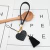 Nova corda de mão DIY acessórios para capa de celular PU corda de couro pingente de borla de amor pingente feito à mão
