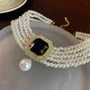 Corea del Sur Vintage Perla Diamante Borla Cadena de Cuello Celebridad Cibernética Sentido del Diseño Elegante Flor Lazo Cadena Clavicular Collar para Mujer