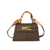 Bolso de mano de nicho para mujer, nuevo modelo de otoño 2026, bolso de hombro casual retro texturizado, bolso pequeño cuadrado cruzado para el día a día