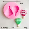 Una variedad de moldes de silicona para globos, azúcar agrietado, horneado de pasteles, arcilla blanda, pegamento, herramientas de modelado