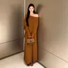 Transmisión en vivo nuevo diseño de otoño sentido de diseño chal adelgazante tipo capa traje de punto de dos piezas falsas