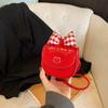 Temperamento de personalidad bolso pequeño para niños bolso de mensajero para niña 2025 nuevo verano lindo diseño de nicho mini sobre rojo de boca