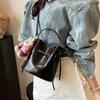 Bolso de Cubo con Cordón de Diseño de Nicho para Mujer 2026 Nuevo Modelo Bolso de Mano Bolso de Mariposa Bolso de Hombro Cruzado de Cuero Suave de Moda