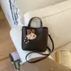 Bolso tipo cubo de alta apariencia para mujer 2026 Nuevo Bolso cruzado casual para hombro Bolso de mano simple de moda moderno para el día a día