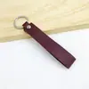 Llavero de PU de color sólido transfronterizo creativo de color caramelo banda ancha de cuero cuerda para la mano simple para llaves de coche de hombre venta al por mayor
