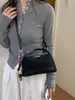 Elegante y chic bolso de mano tipo dumpling para mujer, nuevo modelo otoño e invierno 2026, patchwork de estampado de leopardo de lujo ligero para uso diario, bolso de hombro y cruzado