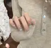 Nuevas tiras de arte de uñas listas para usar al por mayor redondas cortas estilo coreano lunares coloridos rosa nude lindo femenino arte de uñas
