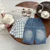 Jeans de moda y geniales para bebé niño principios de otoño 2026 nuevos pantalones casuales desgastados para bebé primavera y otoño pantalones largos versátiles para niños pequeños