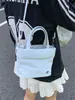 Bolso Pequeño Casual Ins para Mujer 2026 Nuevo Estilo Coreano Bolso Cubo de Lona Diseño de Nicho Bolso de Hombro Único Cruzado