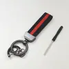 Llavero de Metal para Coche con Cinta de Colores Colgante Decoración Al por Mayor Decoración de Regalo Accesorios Fábrica al por Mayor Paquete Pequeño