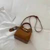 Bolso de mano retro, de color liso, de nicho, moderno para mujer, nuevo bolso cruzado casual y elegante 2026, bolso tipo cubo tote relajado