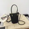 Bolso de mano estilo relajado, nueva colección otoño 2026, bolsa tote moderna y a la moda, popular para el trabajo y los desplazamientos, bolso cruzado tipo cubo para mujer