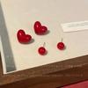Amor otoño e invierno retro vino tinto Amor pendientes diseño de nicho femenino personalidad temperamento versátil bola pendientes de doble cara